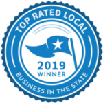 A blue seal with the words " top rated local business in the state."