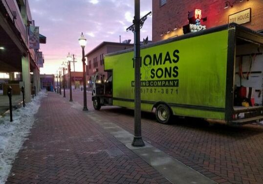 A truck parked on the side of a street.